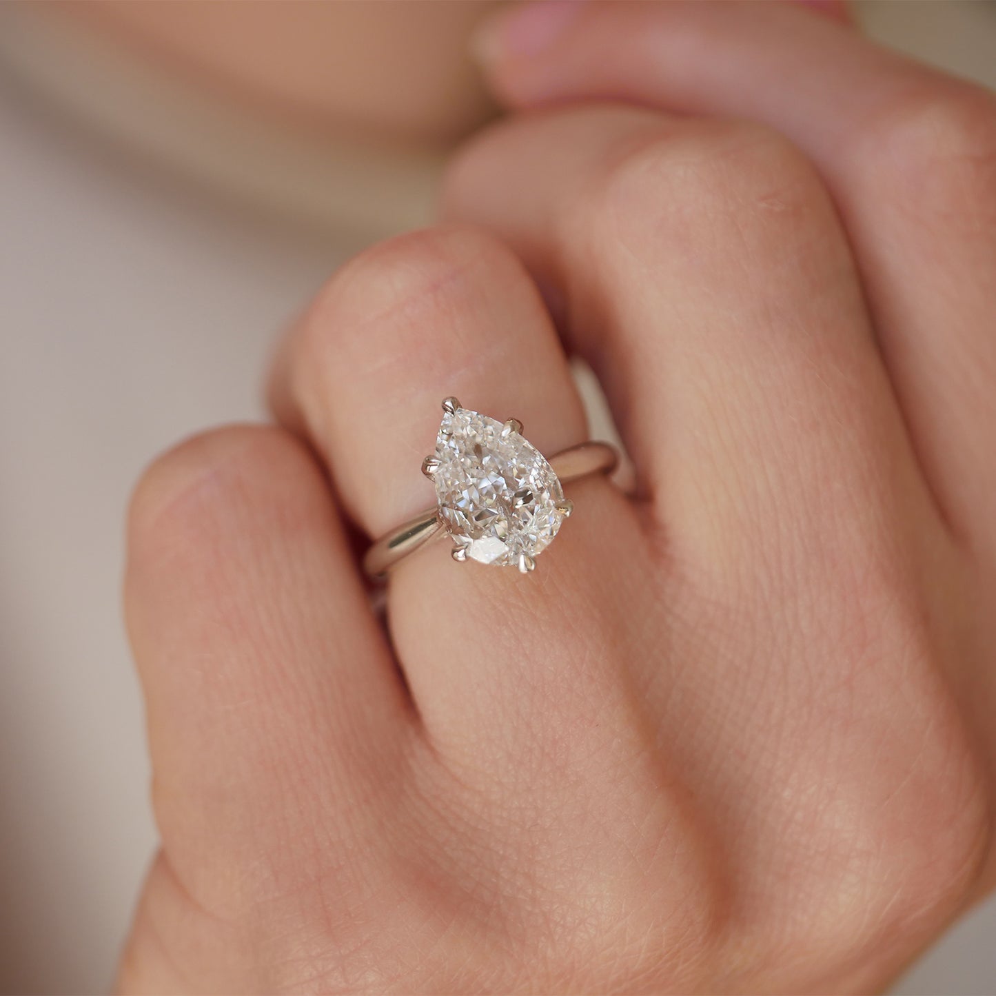 Featuring a stunning lab-grown antique pear-shaped diamond, this engagement ring is perfectly radiant.