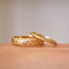 Two floral engraved wedding bands, one thin and one 5mm wide band.