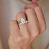 This exquisite lab-grown pear-shaped diamond, designed with antique flair, is complemented by a diamond confetti wedding band, offering a unique and dazzling combination for your special day.