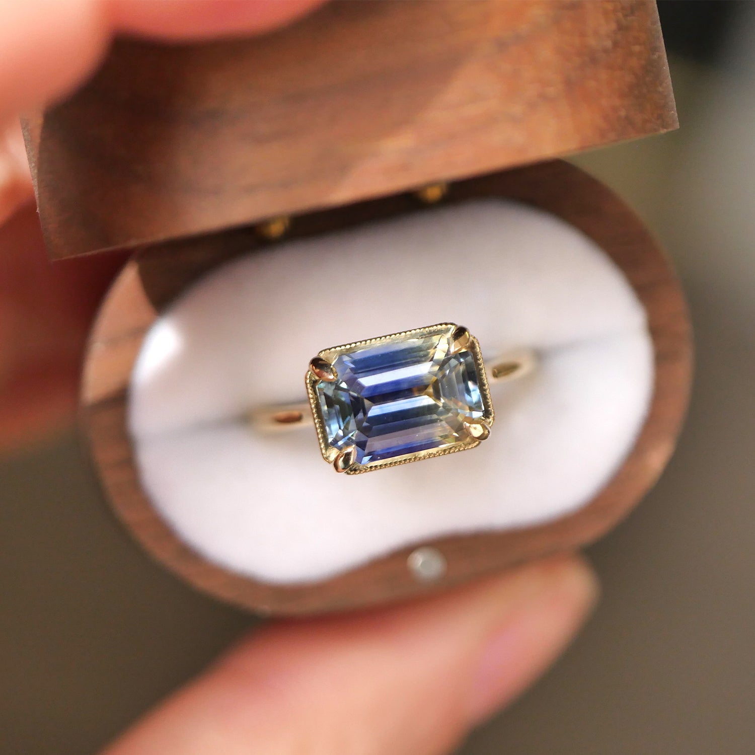 vintage wood box with one of a kind engagement ring with sapphire center stone