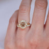 Gold ring with a champagne diamond with a surrounding diamond mosaic