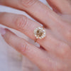 yellow gold ring with a large champagne center diamond and white surrounding white diamonds