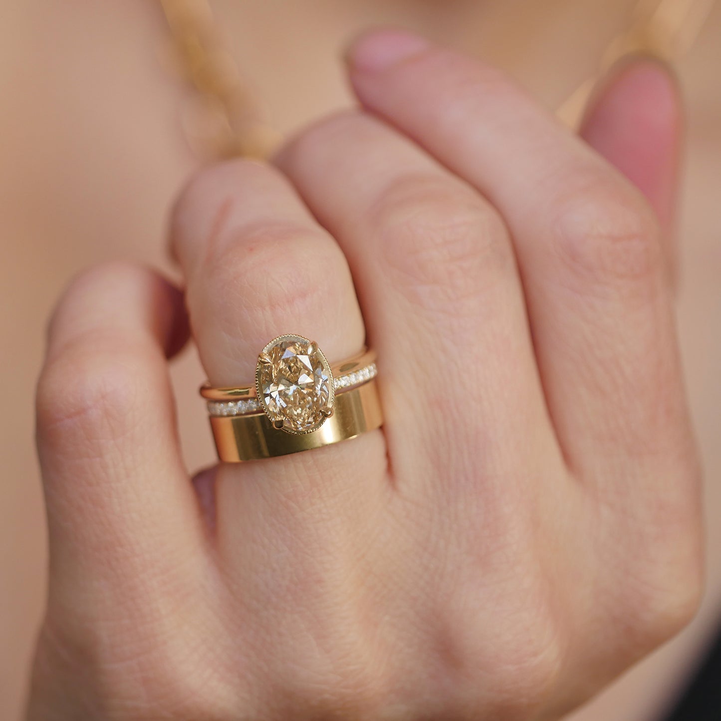 Antique inspired champagne diamond engagement ring with gold and diamond stacking bands