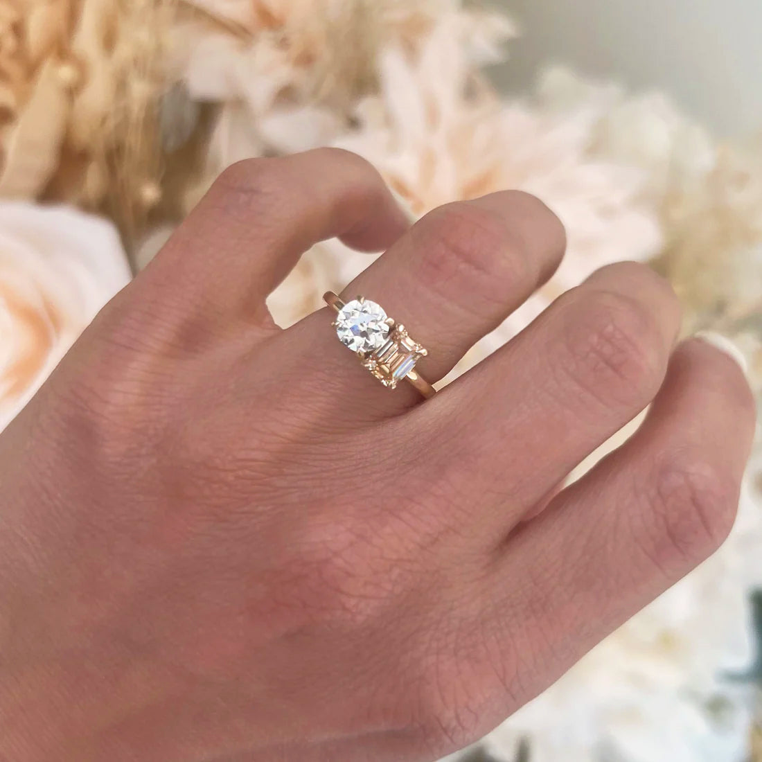 The champagne diamond brings a warm, luxurious touch to the ring, while the round diamond adds an element of timeless brilliance, symbolizing the perfect union of two souls.