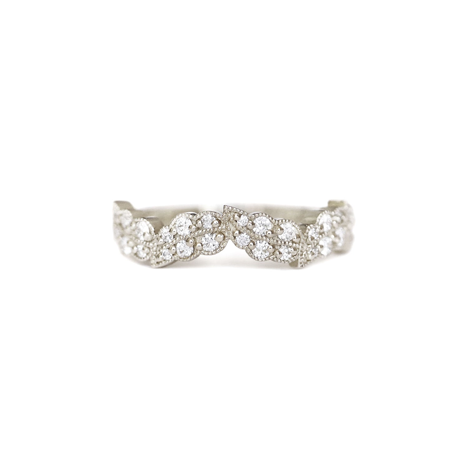 A leaf inspired band with a series of round brilliant cut diamonds set in 14k white gold.