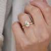 Designed with a split shank that gently tapers toward the diamond, this cushion cut solitaire ring exudes refined elegance and enduring beauty. Stacked with a pave diamond ring.
