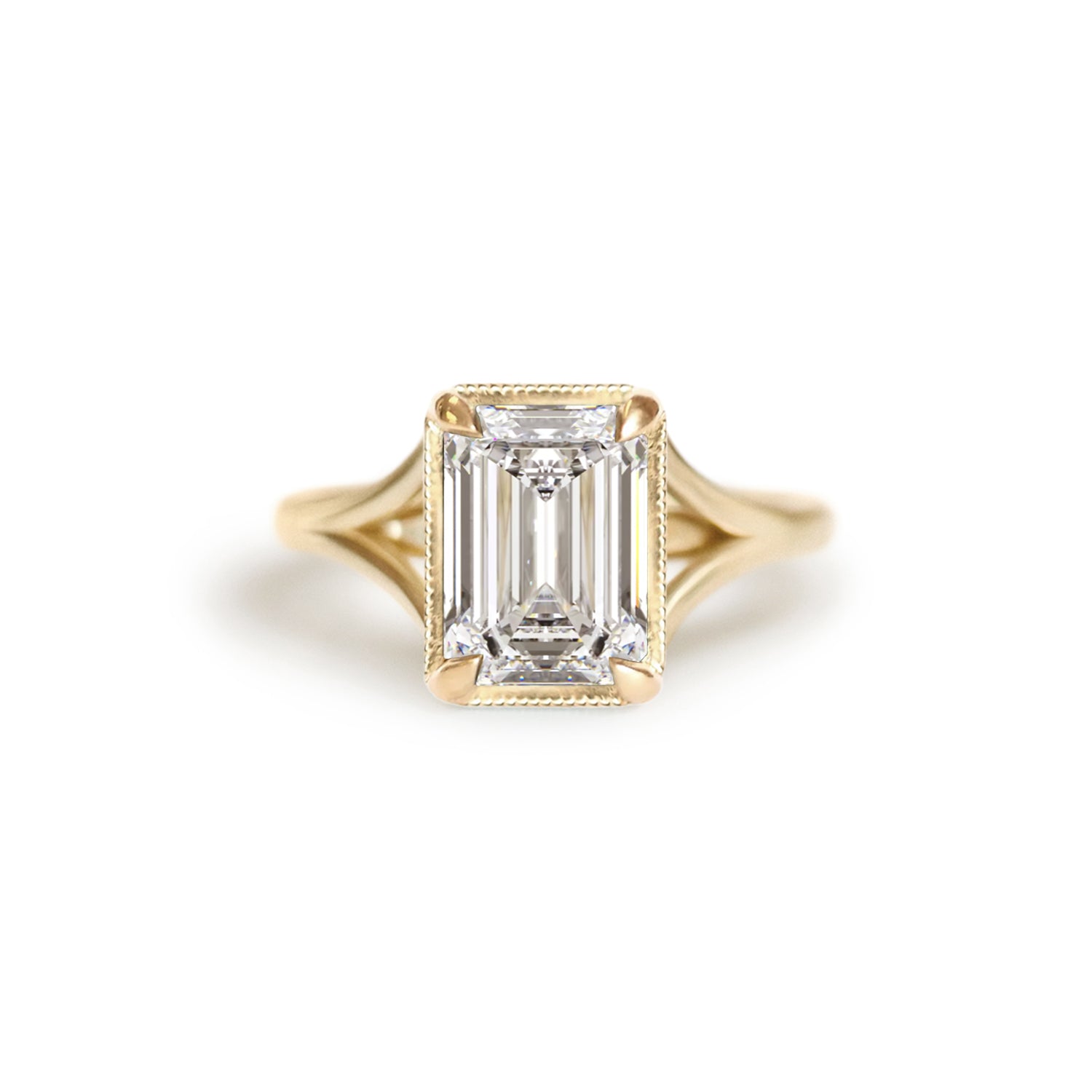 A stunning lab-grown emerald cut diamond sits beautifully in a split shank setting.