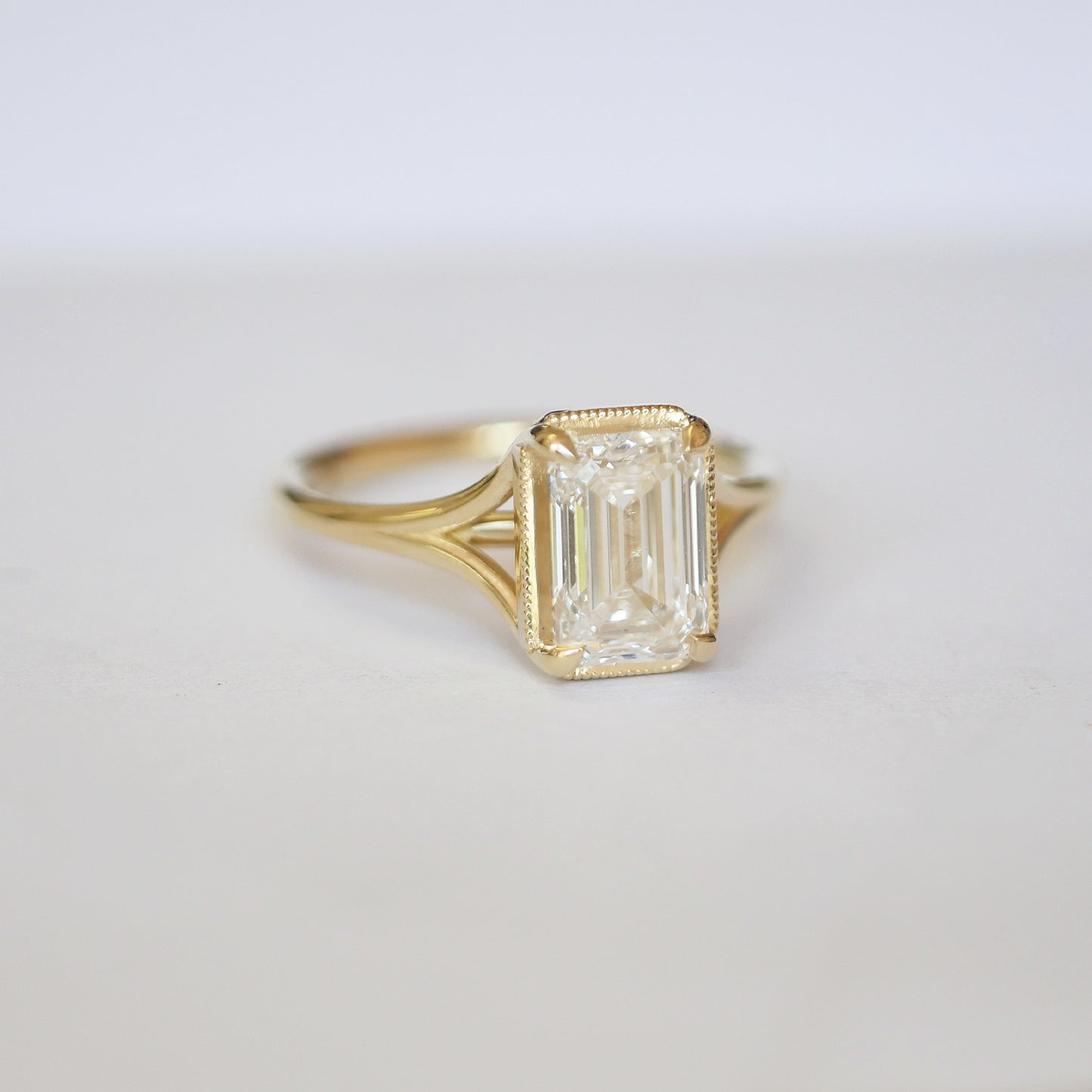 Split Shank Emerald Cut Diamond Solitaire