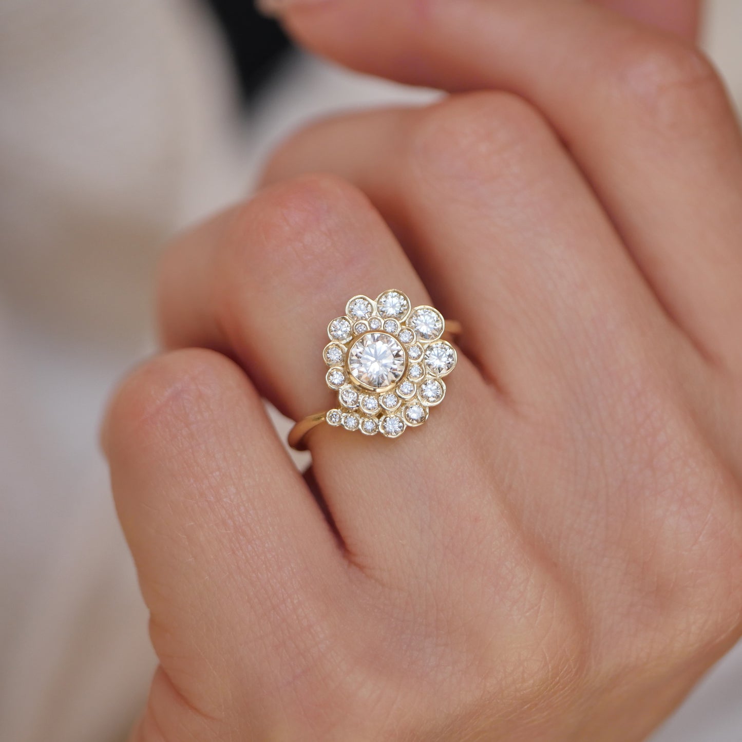 woman wearing vintage inspired oceana engagement ring with lab diamonds in a spiral design