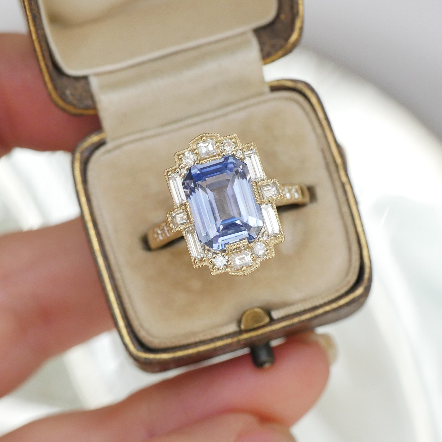 Sky Blue Emerald Cut Sapphire Deco Halo Diamond Ring