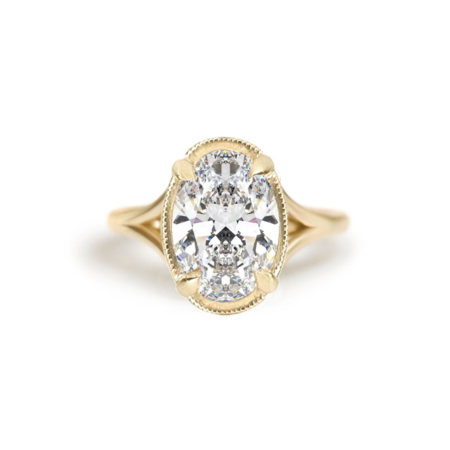 A breathtaking split shank engagement ring featuring oval brilliant cut diamond creating a stunning, elegant ring. Set in 14k yellow gold