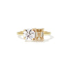 This ring features a dazzling champagne diamond paired with a classic round diamond, creating a stunning contrast of warm elegance and timeless sparkle.