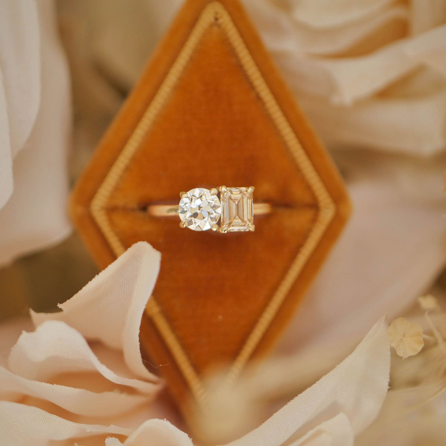 With its elegant pairing of a champagne and round diamond, this toi et moi ring is a beautiful expression of a love that is both unique and enduring.