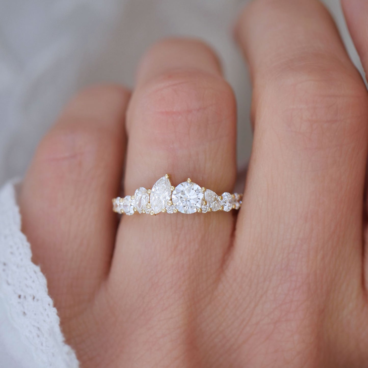 Designed to evoke the feeling of fireworks in the night sky, the Marquise & Round Firework Diamond Mosaic Band boasts an arrangement that feels both festive and timeless.