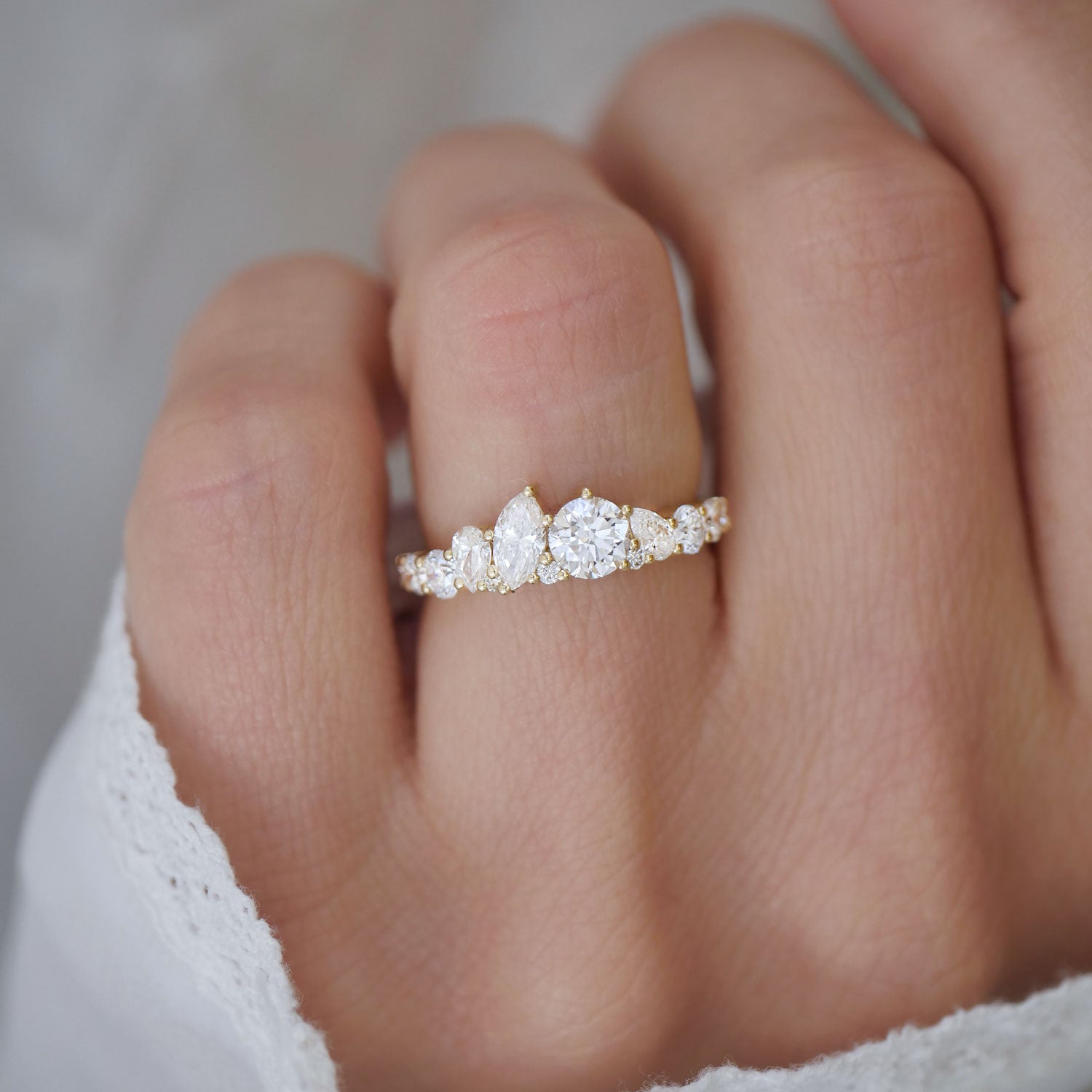 With its intricate mosaic design, the Marquise & Round Firework Diamond Band captures the essence of a brilliant firework display, lighting up your finger with every angle.
