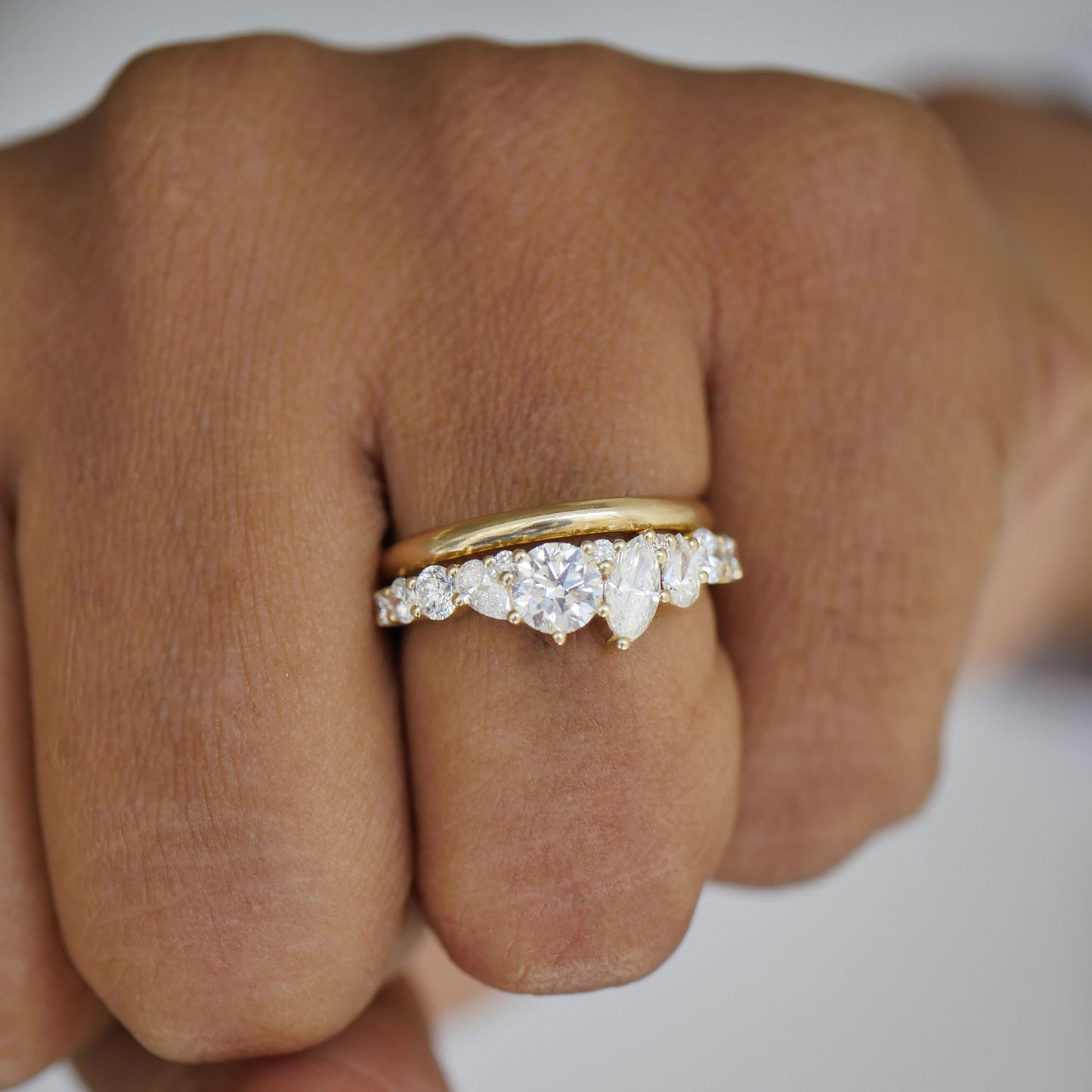 The carefully placed diamonds in the Marquise & Round Firework Diamond Mosaic Band create a dynamic and elegant look, adding sophisticated flair to any occasion.