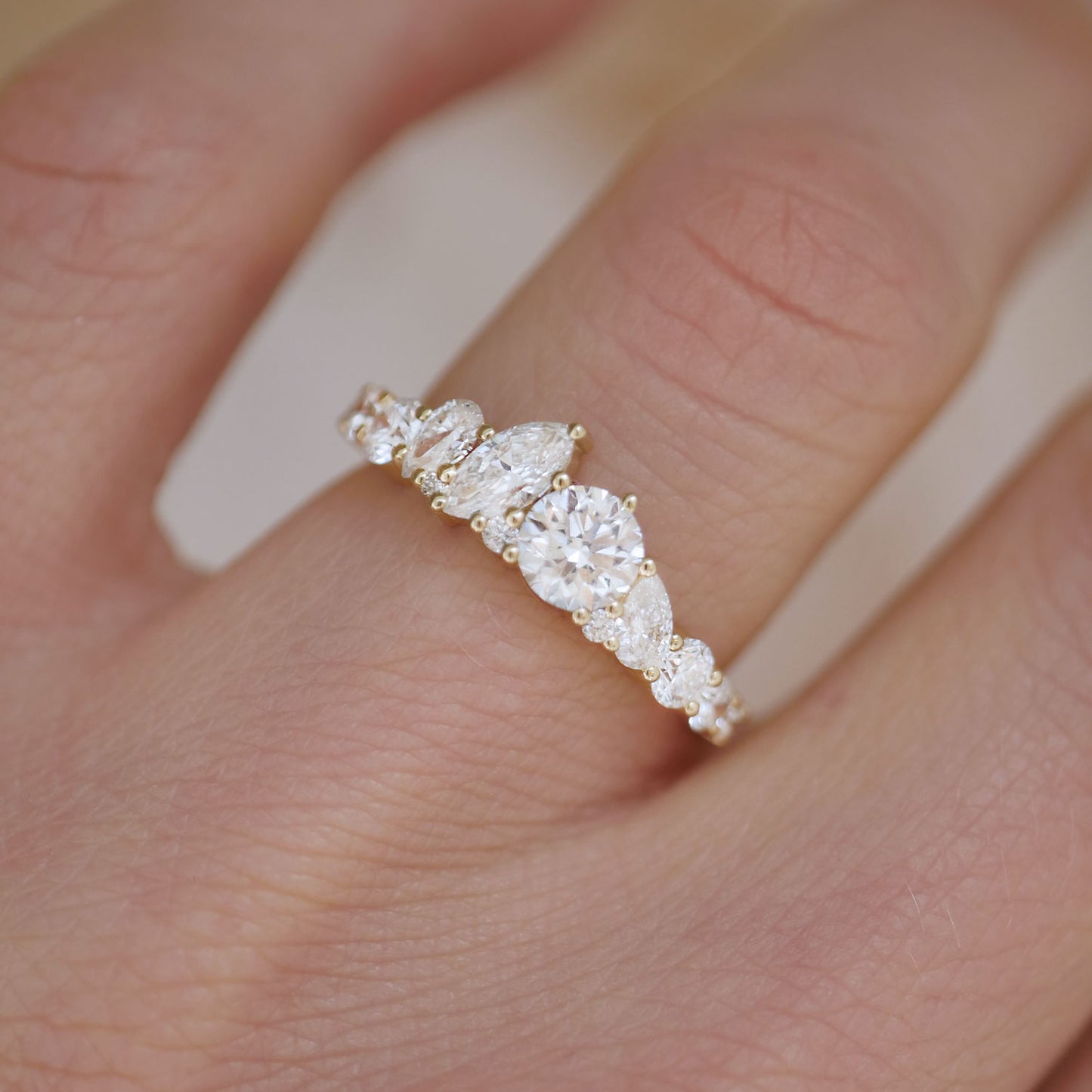 This exquisite band features alternating marquise and round diamonds, crafted to form a dazzling display that resembles the burst of colors in a firework show.