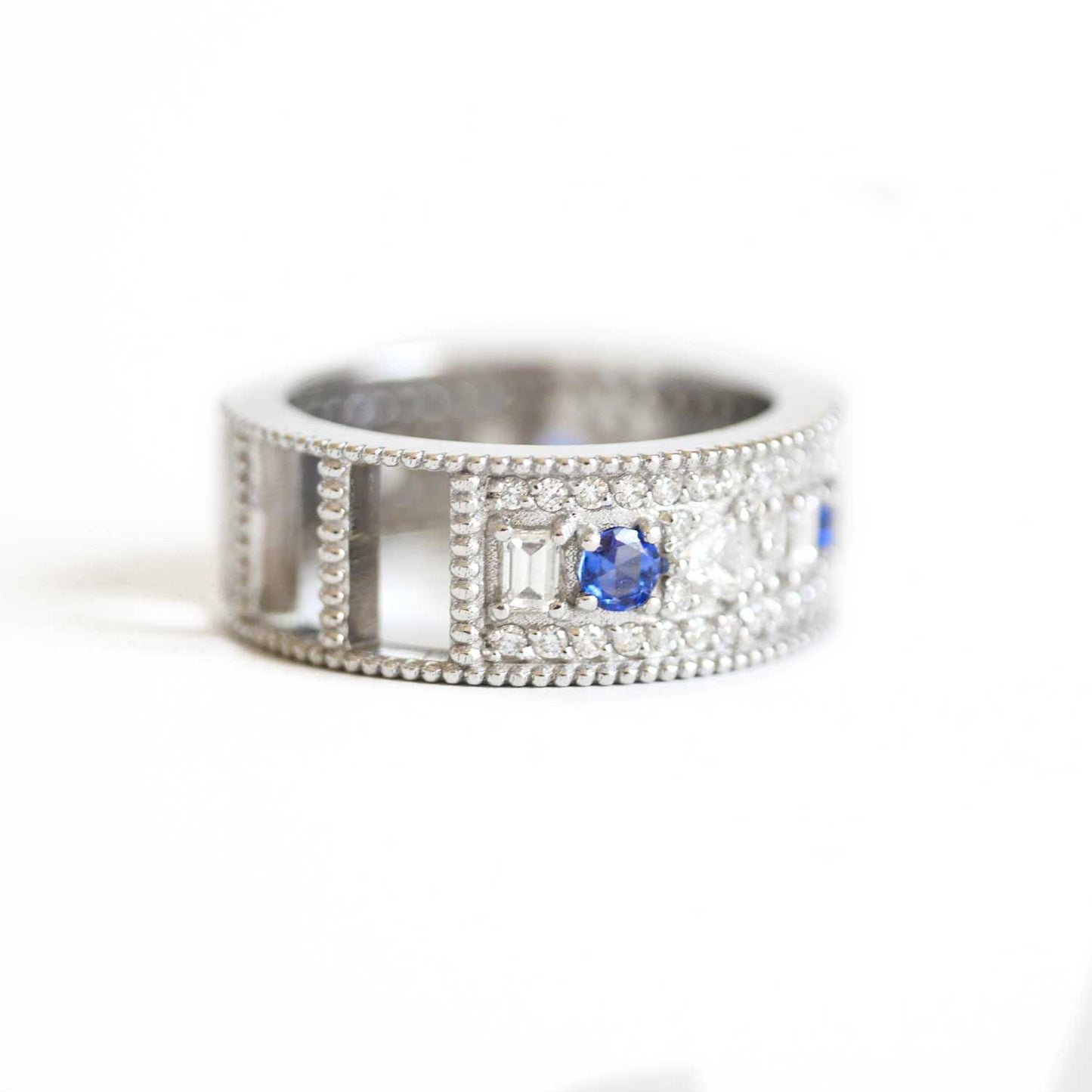 East West Oval Rose Cut Ring with 3/4 diamond pattern & Cylon Sapphires
