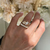 The graceful pear shape of the champagne diamond is designed to capture light from every angle, making it a radiant and unforgettable centerpiece in this toi et moi ring. Stacked with diamond wedding band.