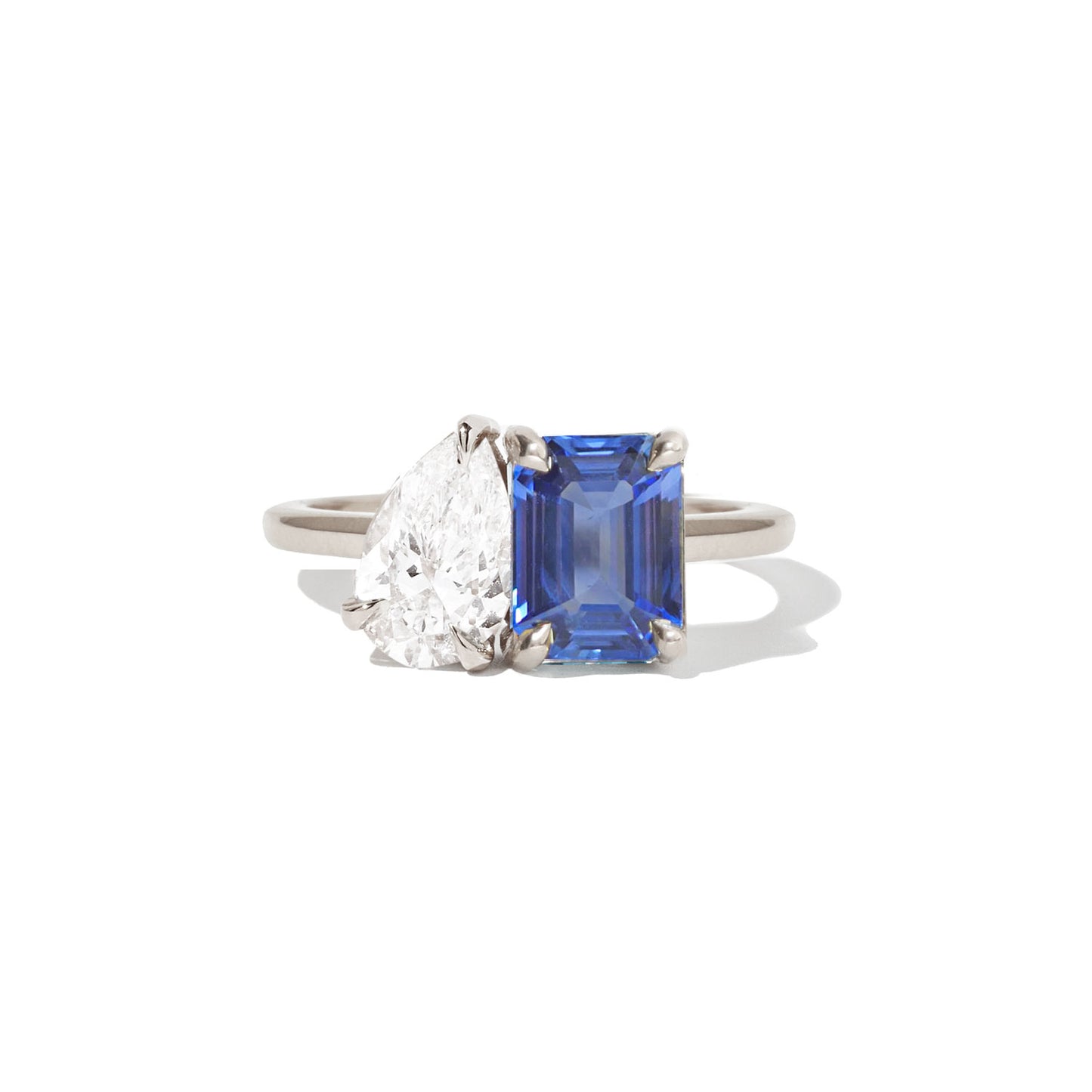 The rich hues of the sapphire and emerald are perfectly balanced by the sparkle of the pear diamond, making this ring a stunning choice for someone who appreciates both color and classic elegance.